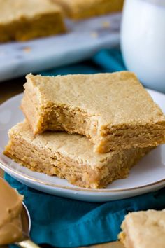 three pieces of peanut butter bars on a plate