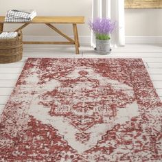 a red and white rug in a room