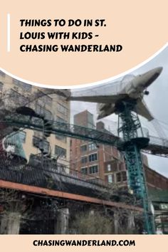 an airplane sitting on top of a metal structure in the middle of a city with text overlay reading things to do in st louis with kids chasing wanderland