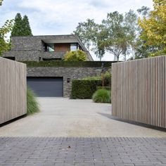 an entrance to a house with wooden fences