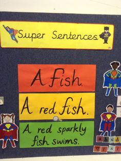 a bulletin board with different types of fish and words written on it, along with pictures of superheros