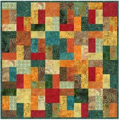 an abstract quilt with many different colors and shapes, including oranges, yellows, green