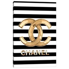 a black and white striped bag with the word chanel in gold foil on it