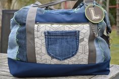 a denim bag with a pocket on the front