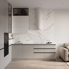 a modern kitchen with white cabinets and marble backsplash