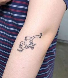 a person with a small tattoo on their arm