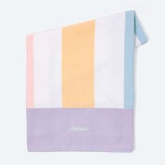 an image of a towel with stripes on it and the word's name written in white