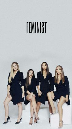 four women sitting next to each other in front of a white background with the word feminist on it