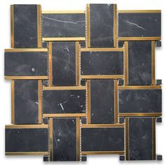 a black and gold mosaic tile wall with square, rectangles in the middle