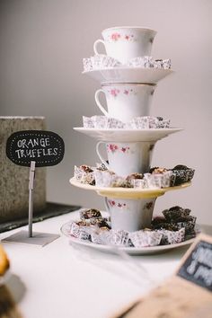 a stack of cups and saucers sitting on top of a table