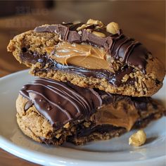 two cookies with chocolate and peanut butter on top