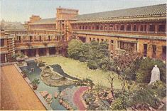 an old photo of a courtyard and building