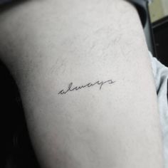 the word always is written in cursive handwriting on the left thigh and upper arm