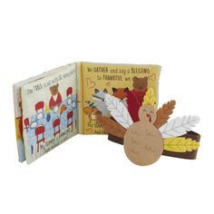 two children's books with turkeys and thanksgiving decorations on them, one is open to