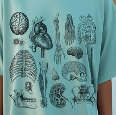 a person wearing a t - shirt with an image of various human body parts on it