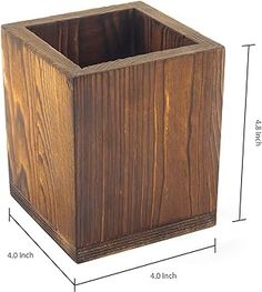 a wooden square container with measurements for the top and bottom section, including heights