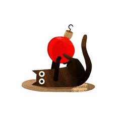 a black cat with a red ornament on its head is sitting in front of a white background