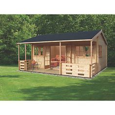 a small wooden cabin sitting on top of a lush green field