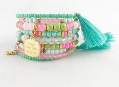 Wrap bangle with charms in mint pink and gold Elegant wrap bracelet on robust spiral wire consisting of nine turns. You wrap this bangle in a spiral around your wrist. Main color mint with pink, rose, light green and turquoise-green, consisting of different beads. Shimmering glass beads, some semi-transparent, marbled glass beads, shiny glass beads in strong colors and faceted glass beads create a beautiful picture. Combined with gold-plated elements. Beautiful gold-plated pendants, such as an e Bracelet With Pendant, Boho Style Bracelets, Wrap Bangles, Vert Turquoise, Spiral Shape, Bracelet Charm, Small Heart, Faceted Glass, Green Turquoise