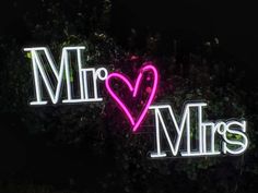 two neon signs that say mr and mrs