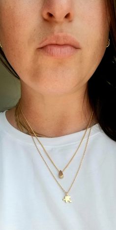 "*Dainty, delicate, and modern puzzle piece necklace! *24k gold plated puzzle piece charm *24k gold plated dainty cable chain with lobster clasp, 20\" *Will not tarnish easily! But please take care of your jewelry! See below! *Please let me know if you would like your chain shorter or an extender to make longer *Layer with other necklaces or wear on its own. Can be dressed up or down for any occasion! *Quality, small batch, unique, chic. Won't tarnish easily! Please take care of your jewelry. Pl Adjustable Dainty Gold-plated Charm Necklace, Minimalist Gold-plated Charm Necklace With Heart Charm, Tiny Minimalist Gold-plated Charm Necklace, Minimalist Tarnish-resistant Yellow Gold Charm Necklaces, Dainty Yellow Gold Square Pendant Charm Necklace, Puzzle Necklace, Puzzle Piece Necklace, Simple Necklace, Dainty Necklace