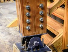 an old wooden machine with metal knobs on it