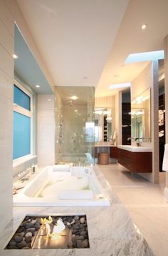 a bathroom with a large jacuzzi tub next to a walk in shower