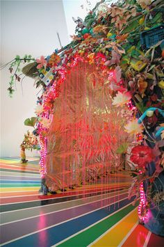 an art installation made out of flowers and plants