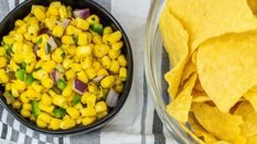 two bowls filled with corn and tortilla chips