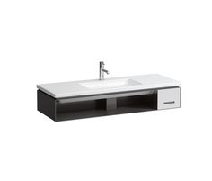 a white sink with black drawers and a faucet