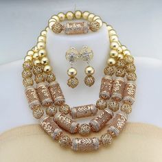 Elevate your Nigerian wedding or party look with this Bead Jewelry. Handcrafted with care, these jewelry pieces add a touch of color and cultural significance to your ensemble, making you stand out with traditional elegance. Gold Jewelry Sets With Round Beads For Parties, Festivals Gold Jewelry Sets, Gold Round Beads Bridal Necklace In Costume Style, Gold Jewelry Sets With Polished Beads, Traditional Gold Jewelry For Party, Gold Beaded Jewelry Sets For Party, Gold Jewelry Sets With Polished Beads For Party, Festive Gold Jewelry Sets, Elegant Large Beads For Jewelry Making