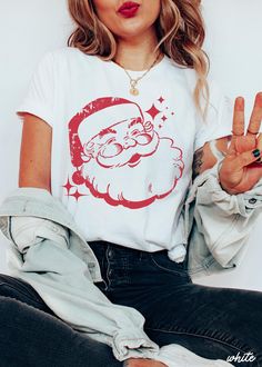 UNISEX T-SHIRT The perfect shirt for Christmas! Screen Printed. These shirts are %100 cotton.  Regular Unisex cut and true to size.  If you want to get an oversized look please size up 1-2 sizes! Santa Graphic, Winter Tees, Santa Tee, Retro Santa, Christmas Matching, Layered Shirts, Santa Shirts, Merry Christmas Shirts, Vintage Santa