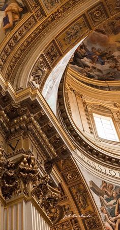 an ornate ceiling with paintings on it