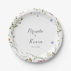 a personalized paper plate with floral designs on the front and bottom, which reads bridal & keven