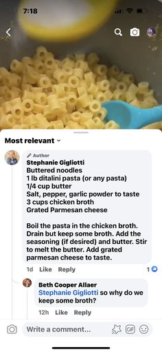 some type of pasta being cooked in a pot with a blue spatula next to it