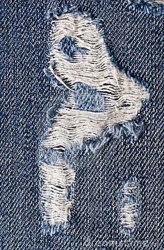 an old pair of blue jeans with white stitchs