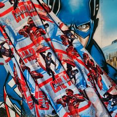 an image of the captain america movie poster on a wall with it's fabric draped over it