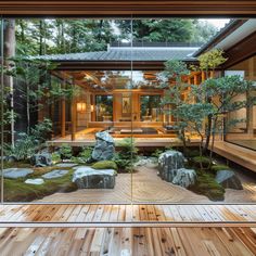 the inside of a house with wood flooring and glass doors leading to an outside patio