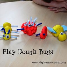 three play dough bugs sitting on top of a table next to each other with the words play dough bugs above them