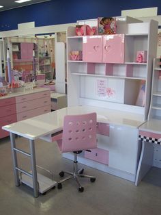 a pink and white desk in a store