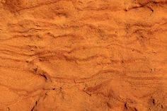 the texture of sand is orange and brown