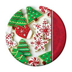 christmas cookies on a plate decorated with red, green and white icing