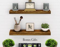 two wooden shelves with plants and other items on them, one shelf has a clock