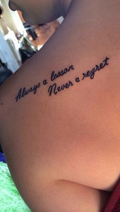 a woman with a tattoo on her back saying, always a lesson never a repeat