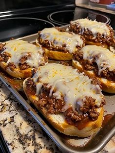 some food is sitting on top of a baking sheet in the oven and ready to be cooked