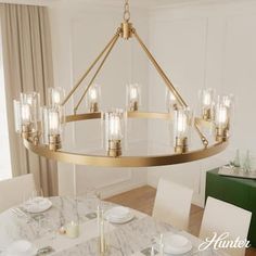 a large chandelier hanging over a dining room table with white plates and silverware