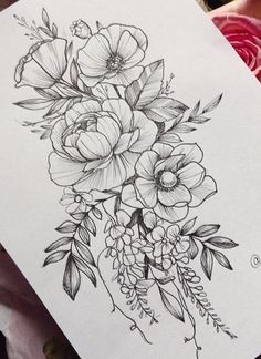 a black and white drawing of flowers on paper