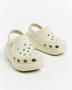 The Classic Platform Clogs by Crocs come in a bone colourway. The clogs are crafted from a water-friendly, buoyant and lightweight fabrication and feature ventilation ports, platform base and pivoting heel straps. Teen Shopping, Destination Dress, Platform Clogs, Jersey Top, Skirted Swimwear, Denim Shop, Strap Heels, Playsuit Jumpsuit, Denim Women