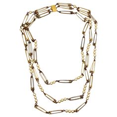 MOSCHINO vintage rare gold tone necklace featuring 3 strands of safety pin links alternating with resin faux pearls. Box clasp. Embossed MOSCHINO. Indicative measurement : length approx. 84 cm (33.07 inches) / with of safety pin : 0.8 cm (0.31 inch). Material : Gold tone metal hardware / Resin faux pearls. NOTES - This is a preloved vintage item, therefore it might have imperfections. - Colors may differ slightly from actual product appearance due to differences in lighting conditions. - As a bu Moschino Vintage, Box Clasp, Gold Tone Necklace, Gianni Versace, Multi Strand Necklace, Measurement Length, Metal Hardware, Strand Necklace, Safety Pin