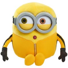 a yellow stuffed toy with large round glasses on it's face and legs, sitting in front of a white background